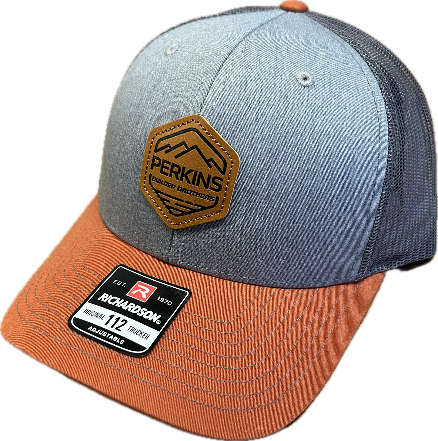 Debossed Faux Leather Patch - Richardson 112 Snapback Trucker Hat - Grey/Charcoal/Dark Orange - Perkins Builder Brothers